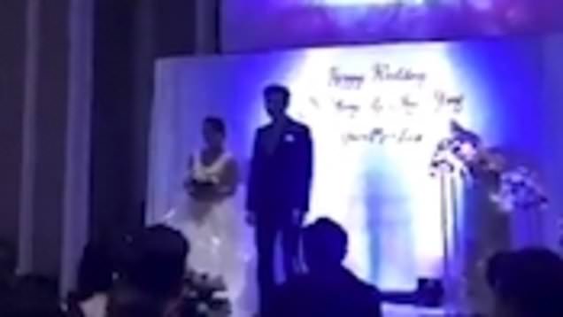 Wedding came to a dramatic end after the Groom played a video of his bride in bed with another man in front of all the guests in the wedding hall