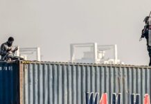 Information Minister Claims Man on Container Was Filming TikTok, Not Praying Information Minister Claims Man on Container Was Filming TikTok, Not Praying